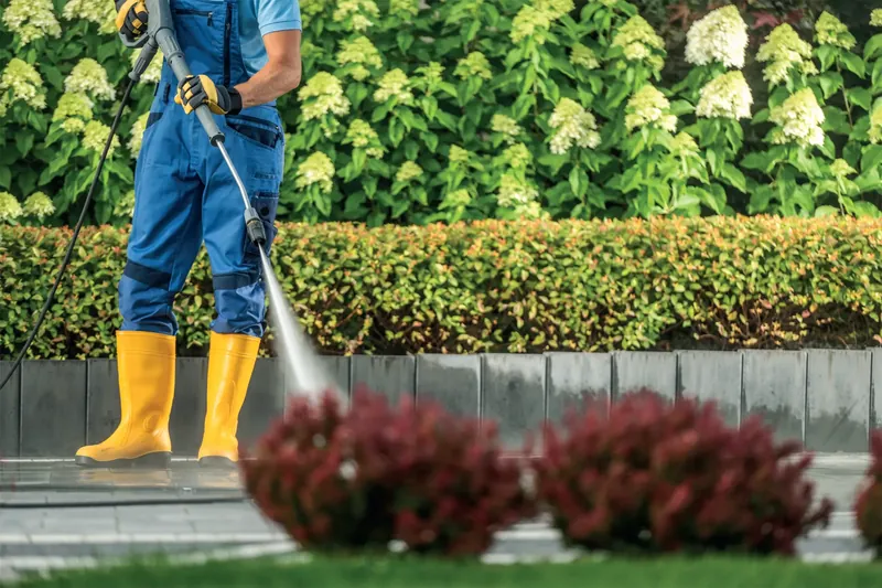 Pressure washing a paved garden path