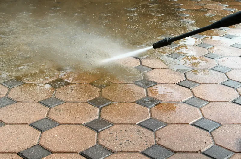 Power washing hexagonal patio tiles